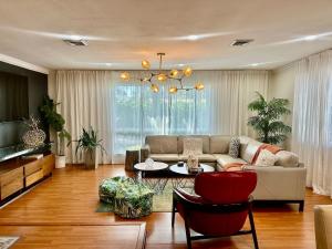 a living room with a couch and a table at The Hollywood Beach Experience in Hollywood
