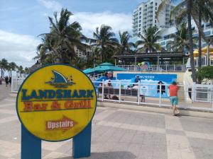 a sign for a bar and grill on the beach at The Hollywood Beach Experience in Hollywood