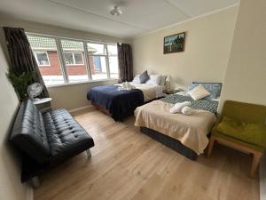 Ένα ή περισσότερα κρεβάτια σε δωμάτιο στο Auckland Northcote Holiday home