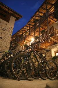 a group of bikes parked in front of a building at Ostello del Castello Tirano in Tirano