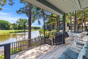 a porch with chairs and a view of a river at TP4937: 4937 Turtle Point in Kiawah Island