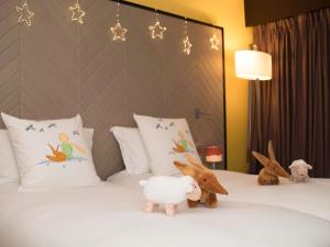 Ένα ή περισσότερα κρεβάτια σε δωμάτιο στο Sofitel Strasbourg Grande Ile +194 φωτογραφίες