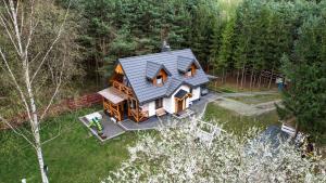 an overhead view of a house in the woods at Domek Sosenka Roztocze Hutki in Krasnobród