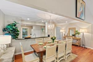 a kitchen and dining room with a table and chairs at AV3-20: 3 20th Avenue in Isle of Palms