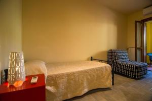 Postel nebo postele na pokoji v ubytování Quadrilocale Stella + 8 fotografií