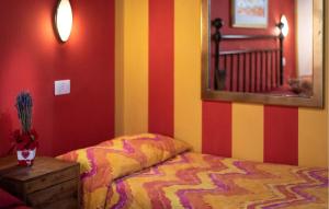 a bedroom with a bed and a mirror on the wall at Svasso Maggiore in Pucciarelli