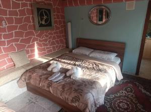 Postel nebo postele na pokoji v ubytování The cave of Cyclops