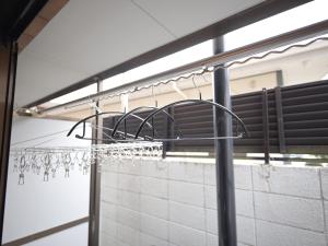 a bunch of wine glasses hanging on a rack at The Nest Koenji Cozy Stay near Station Easy Access to Shinjuku in Tokyo +28 photos