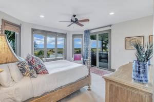 a bedroom with a bed and a ceiling fan at MG3083: 3083 Marshgate in Seabrook Island +64 photos