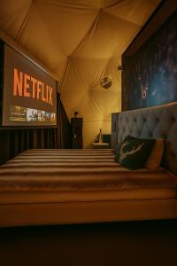 a bedroom with a bed in a tent at Glamping Špindl One&Only in Špindlerův Mlýn