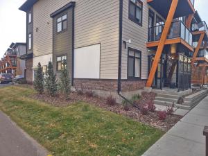 a house with a large window on the side of it at A stylish 2 BDR with a blend of cozy and peace! in Calgary