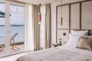 Ένα ή περισσότερα κρεβάτια σε δωμάτιο στο Les Bassans