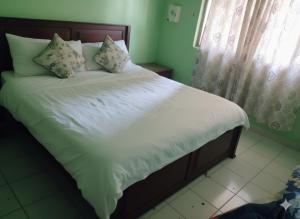 Ένα ή περισσότερα κρεβάτια σε δωμάτιο στο BIRD'S NEST Vila