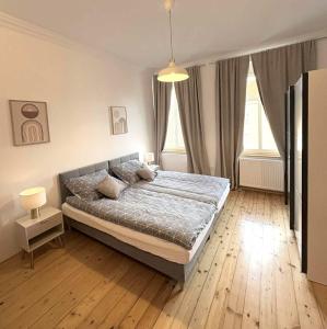 Postel nebo postele na pokoji v ubytování Parkview Premium Apartment