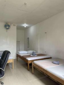 Ένα ή περισσότερα κρεβάτια σε δωμάτιο στο RedDot Guest House