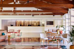 a living room with chairs and a couch at Sol Falcó Menorca in Son Xoriguer