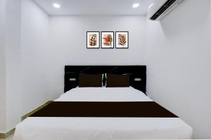 Ένα ή περισσότερα κρεβάτια σε δωμάτιο στο Hotel O DRN Palace