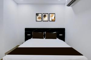 Ένα ή περισσότερα κρεβάτια σε δωμάτιο στο Hotel O DRN Palace