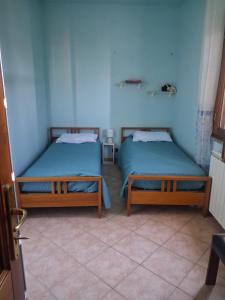 Ένα ή περισσότερα κρεβάτια σε δωμάτιο στο Casa vacanza Sardegna