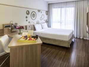 Ένα ή περισσότερα κρεβάτια σε δωμάτιο στο Mercure Sao Paulo Alamedas +139 φωτογραφίες