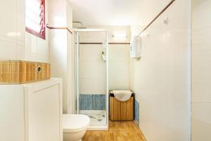 a bathroom with a toilet and a shower at Apartment in Los Cristianos WIFI in Arona +16 photos