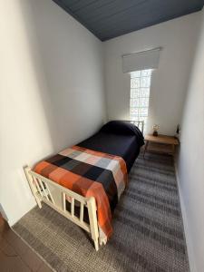 En eller flere senge i et værelse på Departamento 102 planta alta