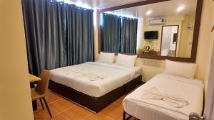 Ένα ή περισσότερα κρεβάτια σε δωμάτιο στο JC House Hotel +104 φωτογραφίες