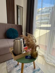 a coffee table with a tea kettle on it in a living room at Guest house, Small beach in Ulcinj
