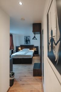a bedroom with two beds in a room at Hotel Restaurant Latio in Cologne