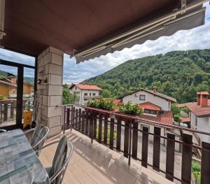 a balcony with a view of a mountain at Apartma Mika in Most na Soči