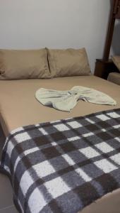 Ένα ή περισσότερα κρεβάτια σε δωμάτιο στο Pousada Catavento