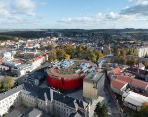 an aerial view of a city with a red building at Hotel Aréna in Jihlava
