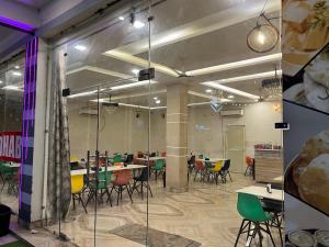 a conference room with tables and chairs in it at Maharaja hotel and dhaba in Roorkee