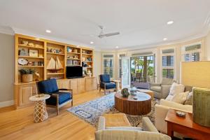 a living room with a couch and a table at PALM3700: 3700 Palm Blvd. in Isle of Palms