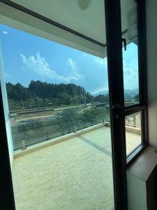 a view of a river from a window at Khách sạn Giang Sơn Bắc Hà Lào Cai in Bắc Hà