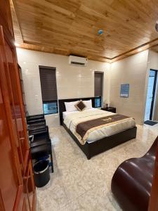 Кровать или кровати в номере Khách sạn Giang Sơn Bắc Hà Lào Cai +3 фотографии