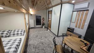 a living room with a couch and a table at Pensjonat Lubianka in Starachowice