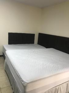 Postel nebo postele na pokoji v ubytování Moradas Araújo