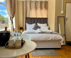 Ένα ή περισσότερα κρεβάτια σε δωμάτιο στο Jabulani's Serenity +14 φωτογραφίες