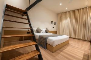 Ένα ή περισσότερα κρεβάτια σε δωμάτιο στο The Holiday Home +34 φωτογραφίες