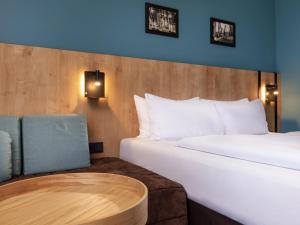 Ένα ή περισσότερα κρεβάτια σε δωμάτιο στο Mercure Hotel München Neuperlach Süd