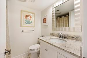 a white bathroom with a sink and a toilet at PW13105: 13105 Pelican Watch in Seabrook Island +36 photos