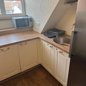 Kuchyň nebo kuchyňský kout v ubytování Rose Boardinghouse 24h-7d Self Check-In Automat