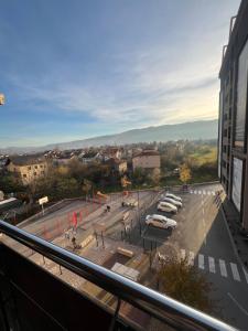a view of a parking lot with cars parked at Bulevar in Sarajevo +9 photos
