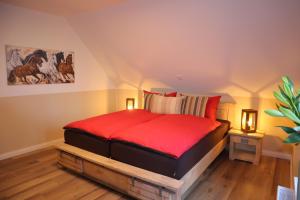 Postel nebo postele na pokoji v ubytování Landhuus an´n Peerhamm