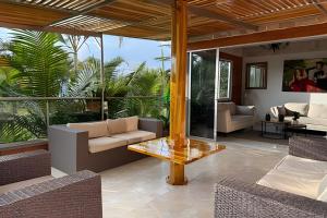 a living room with a couch and a table at Palos altos house Poblado 6 min to Provenza in El Poblado