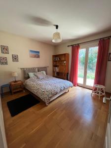 Ένα ή περισσότερα κρεβάτια σε δωμάτιο στο La Villa Moum - Maison de famille