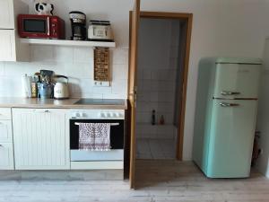 Kuchyň nebo kuchyňský kout v ubytování Elbblick + 11 fotografií