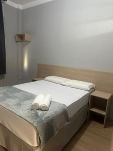 Ένα ή περισσότερα κρεβάτια σε δωμάτιο στο Unity Hotel - Santos