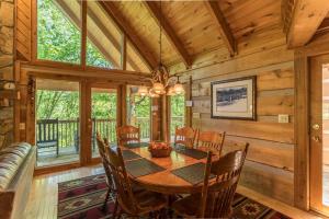 a dining room with a table and chairs at Almost Heaven in Sugar Grove +26 photos
